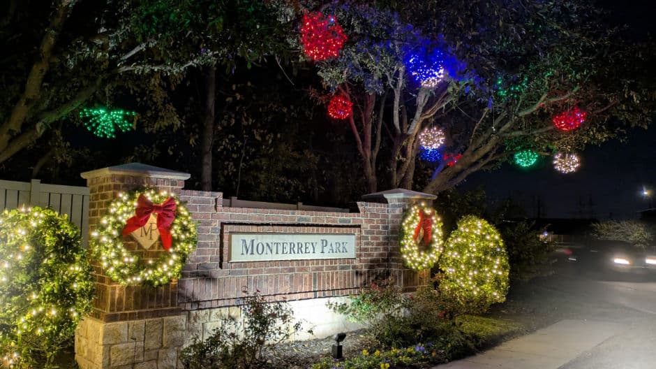 Monterrey Park entrance lit up with festive Christmas decorations and colorful lights.